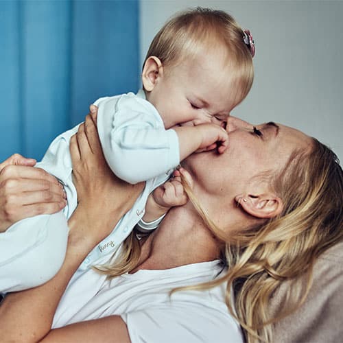 Mother weaning her baby from breastfeeding